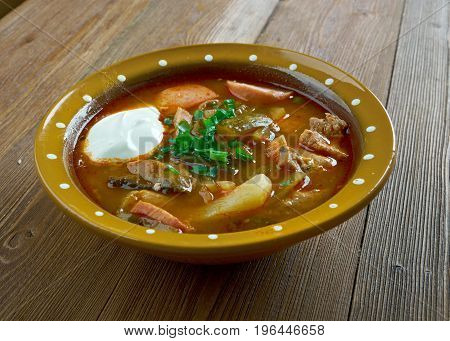 meat seljanka thick spicy and sour Russian soup. ingredient meat pickled cucumbers ham sausages or mushrooms.