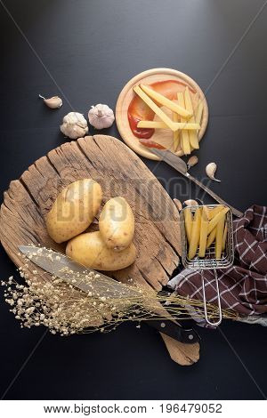 Deep Fried Potato Slice And Potato On Wooden Baord For Cooking