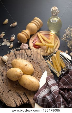 Deep Fried Potato Slice And Potato On Wooden Baord For Cooking