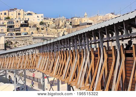 JERUSALEM, ISRAEL - June 15, 2017: Mughrabi Bridge, a wooden bridge connecting the Wailing Wall area with the Mughrabi Gate of the Temple Mount in Jerusalem, Israel