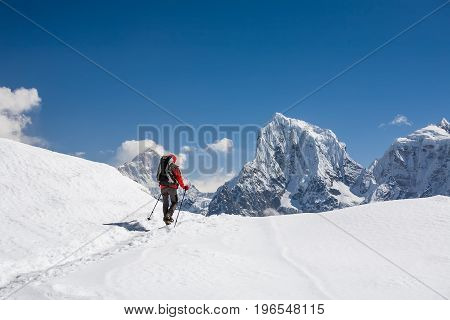 Trekker is walking by Renjo La pass in Everest region