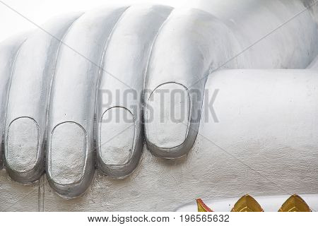 Close Up hand of the big silver buddha statue or Luang Phor Ngern statue at Wat Paknam Boong Sapang Ubonratchathani.