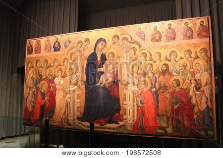 Italy Siena - December 26 2016: Maesta with Twenty Angels and Nineteen Saints is the famous painting of Duccio di buoninsegna in museo dell'Opera metropolitana del Duomo on December 26 2016 in Siena Tuscany Italy.
