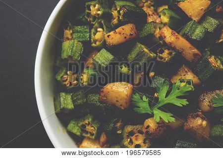 Indian masala fried bhindi or bhendi or Okra or ladyfinger curry or sabji, selective focus