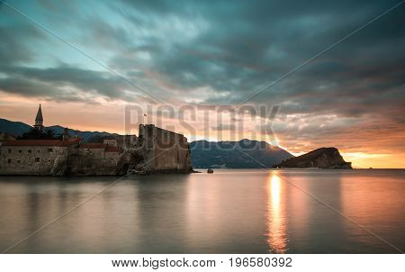 Clouds over the sea and the old city at sunrise