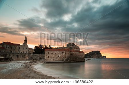 Clouds over the sea and the old city at sunrise