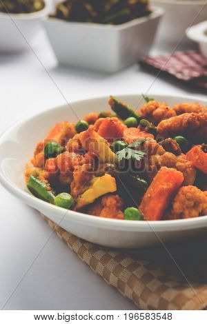 indian spicy food Gobi matar Masala or cauliflower curry with green peas or phool gobi fry, selective focus