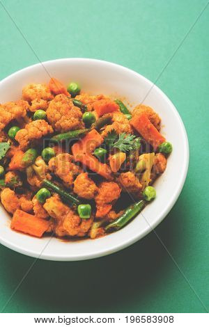 indian spicy food Gobi matar Masala or cauliflower curry with green peas or phool gobi fry, selective focus