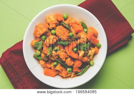 indian spicy food Gobi matar Masala or cauliflower curry with green peas or phool gobi fry, selective focus