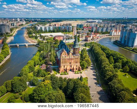 Aerial cityscape of Kant Island in Kaliningrad, Russia at sunny summer day with white clouds in the blue sky
