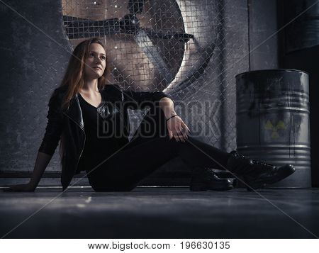 Beautiful girl rocker in black leather. Beautiful long hair