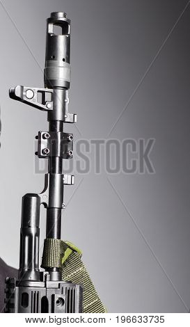 Close-up of Machine gun on the gray background.