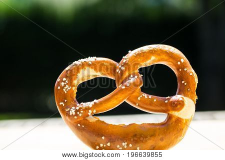 Bread alone with green background, pretzel, munich