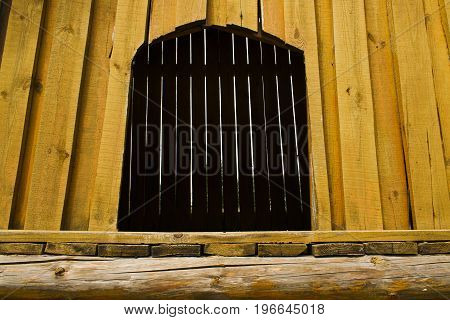 Arch leading to nowhere yellow color of wood