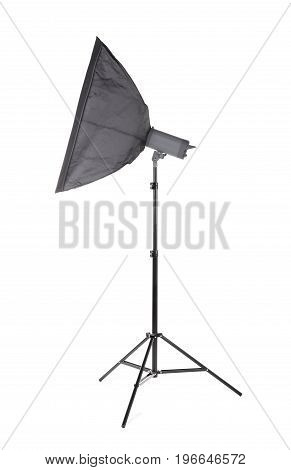 A modern gray softbox isolated over the white background. Professional lighting equipment for photo studios. A big stripbox with a flashlight on a tall tripod. Photographic accessory.