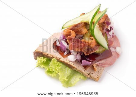 Danish specialties and national dishes high-quality open sandwich.The very famous piece of butterbread called Veterinarian's midnight snack consisting of liverpostej jelly and salty Beef meat isolated on white background