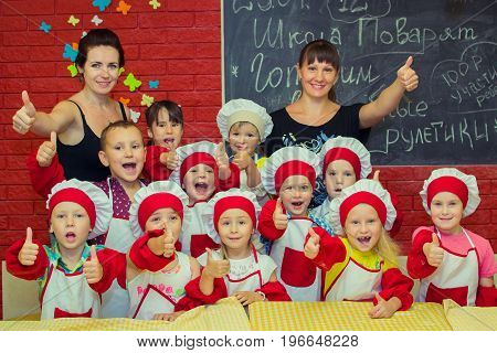 Alchevsk, Ukraine - July 23, 2017: School cook for children. Meat rolls with cheese are prepared