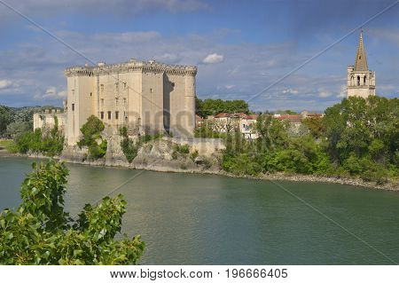 View to King Rene's castle and St Martha's Church from opposite bank of Rhone river. Tarascon France