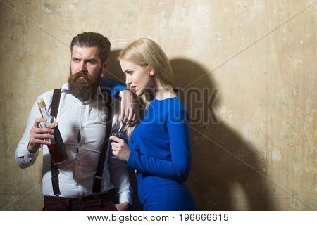 Couple In Love Posing With Bottle And Glass Of Liqueur