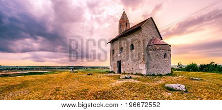 Lonely Drazovsky church in the country and dramatic colorful sky.