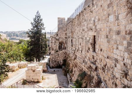 Fragment of the fortress walls and Zion Gate street near to the Zion Gate in the old town in Jerusalem Israel