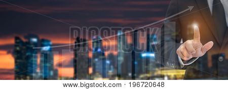 Close Up Of Businessman Touching Digital Screen With Finger. Business Concept.financial Charts Showi