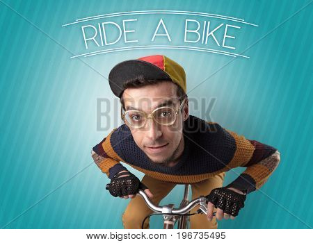 Kooky young guy on a bike with cyclist keywording and streaky background