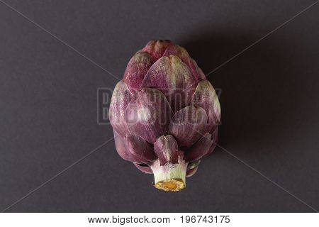 Baby Ripping Organic Artichokes With Lemon. Food For A Vegan And