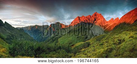 Amazing sunset and red afterglow in high mountains. Splendid alpenglow. Alps, Bavaria, Germany.