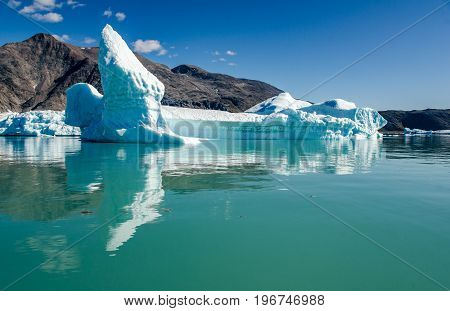 Small icebergs and reflections near the coast Greenland