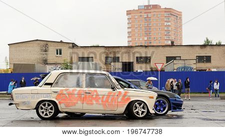 Orel Russia July 22 2017: Dynamica car festival. Old Soviet car VAZ Lada with graffiti with industrial background