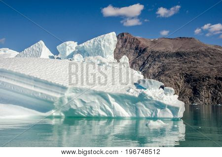 Small icebergs and reflections near the coast Greenland