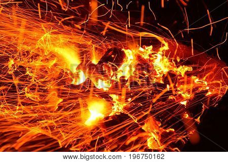 Hot sparking live-coals burning in a barbecue