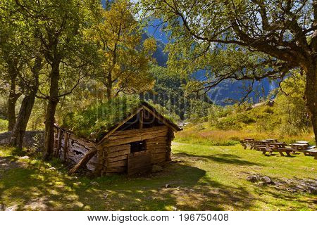 Old house near Briksdal glacier - nature and travel background