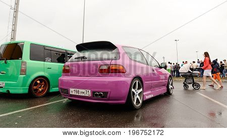 Orel Russia July 22 2017: Dynamica car festival. Tuned cars on wet asphalt horizontal