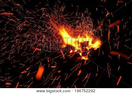 Hot sparking live-coals burning in a barbecue
