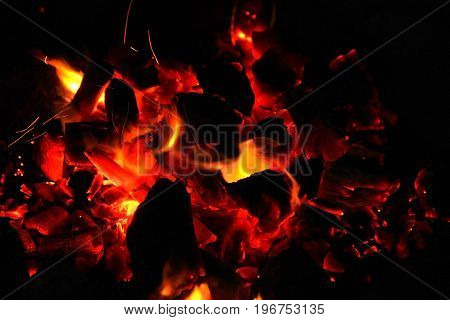 Hot sparking live-coals burning in a barbecue