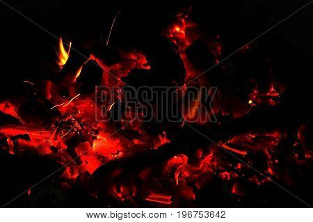 Hot sparking live-coals burning in a barbecue