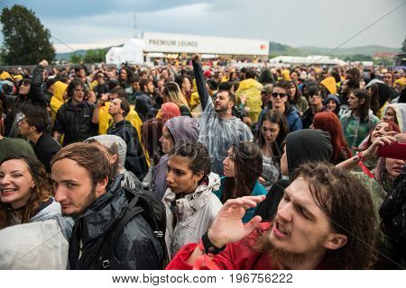 Headbanging Crowd In The First Row At A Hardcore Concert