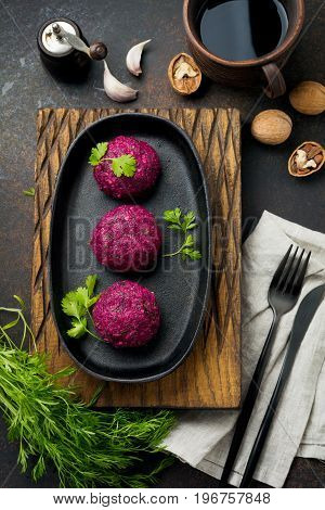 Snack of beet cabbage walnut and cilantro. Traditional Georgian dish Pkhali. Selective focus.Top view. Copy space.