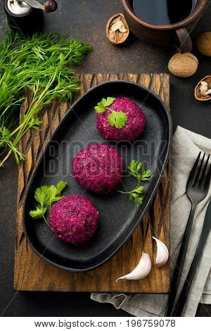 Snack of beet cabbage walnut and cilantro. Traditional Georgian dish Pkhali. Selective focus.Top view. Copy space.