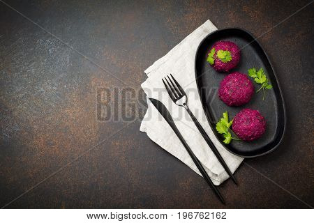 Snack of beet cabbage walnut and cilantro. Traditional Georgian dish Pkhali. Selective focus.Top view. Copy space.