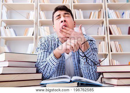 Young student studying with books