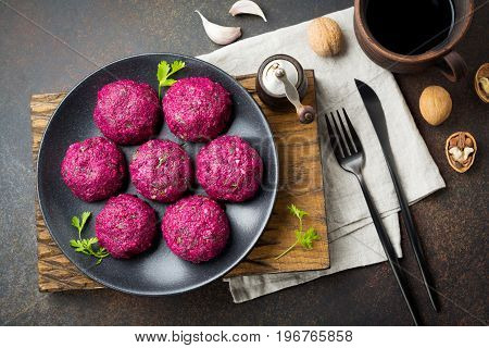 Snack of beet cabbage walnut and cilantro. Traditional Georgian dish Pkhali. Selective focus.Top view. Copy space.