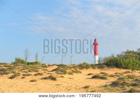 Lighthouse red and white at the French west beach