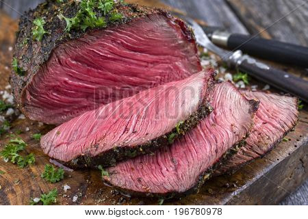 Barbecue Wagyu Point Steak sliced as close-up on a cutting board