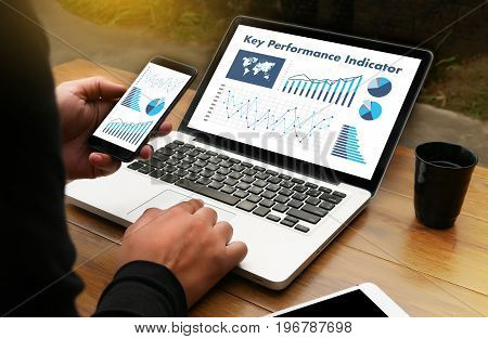 Kpi Acronym (key Performance Indicator) Business Team Hands At Work With Financial Reports And A Lap