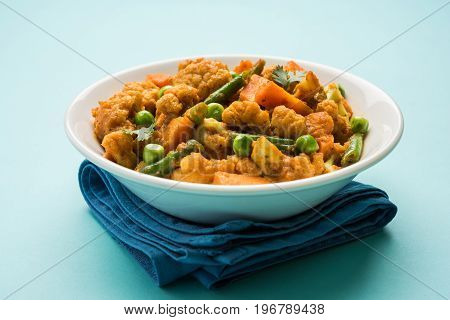 indian spicy food Gobi matar Masala or cauliflower curry with green peas or phool gobi fry, selective focus