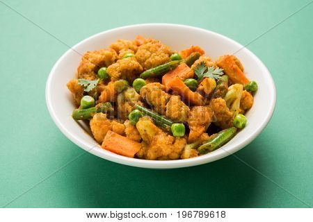 indian spicy food Gobi matar Masala or cauliflower curry with green peas or phool gobi fry, selective focus