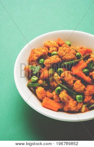 indian spicy food Gobi matar Masala or cauliflower curry with green peas or phool gobi fry, selective focus